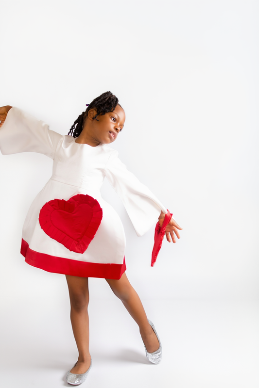 TULIP HEART DRESS — Exaggerated-hip dress with a frilled heart pocket detail and contrast hem.