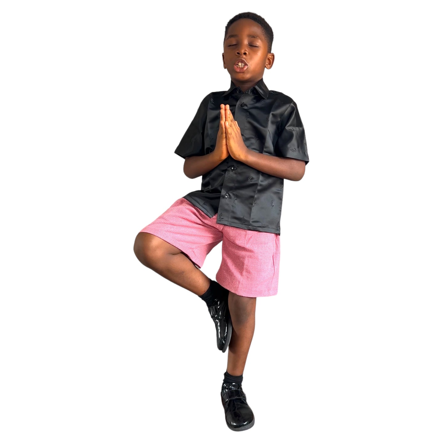 Black embossed shirt and pink shorts